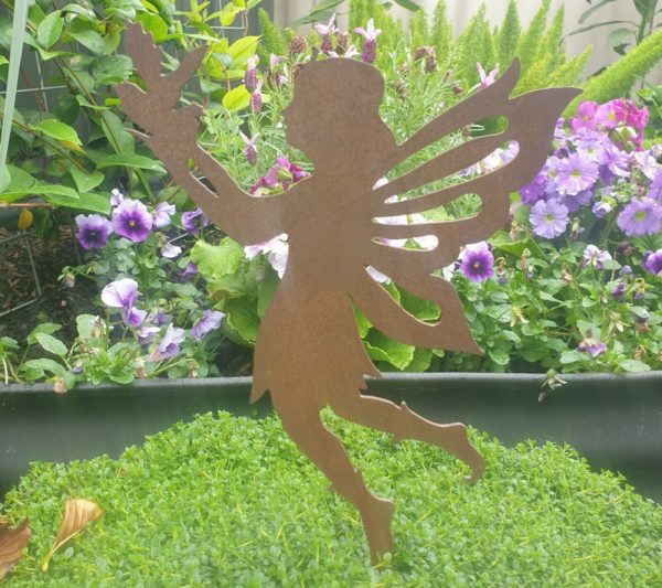 A rusted metal Fairy with Bird garden sculpture, laser-cut from 1.6mm Corten steel. The fairy is perched with a bird, designed for garden pots. Dimensions: 28cm high x 16cm wide.