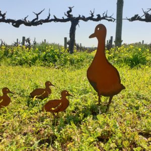 Walking Duck Family Garden Stakes set showing one large duck and three small ducklings in rusted metal finish for outdoor decoration.