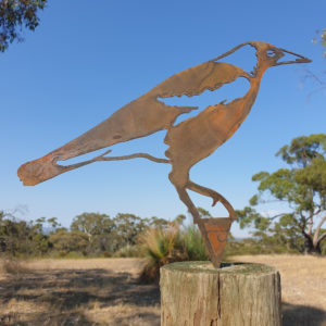 Laser cut Magpie Garden Stake made from Corten steel, showcasing a rustic design for gardens.