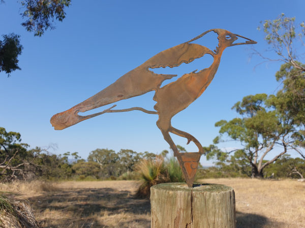 Laser cut Magpie Garden Stake made from Corten steel, showcasing a rustic design for gardens.