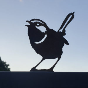 Superb Fairy Wren garden sculpture in rusted Corten steel, 14 cm tall, designed for garden posts and fences with a pre-drilled mounting hole.