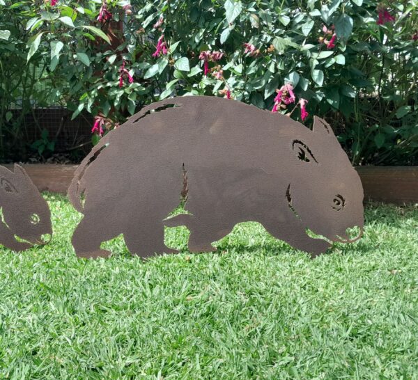 Lifelike rusted metal Wombat Garden Stake measuring 60cm x 42cm, made from Corten steel with a rustic patina for outdoor garden décor.